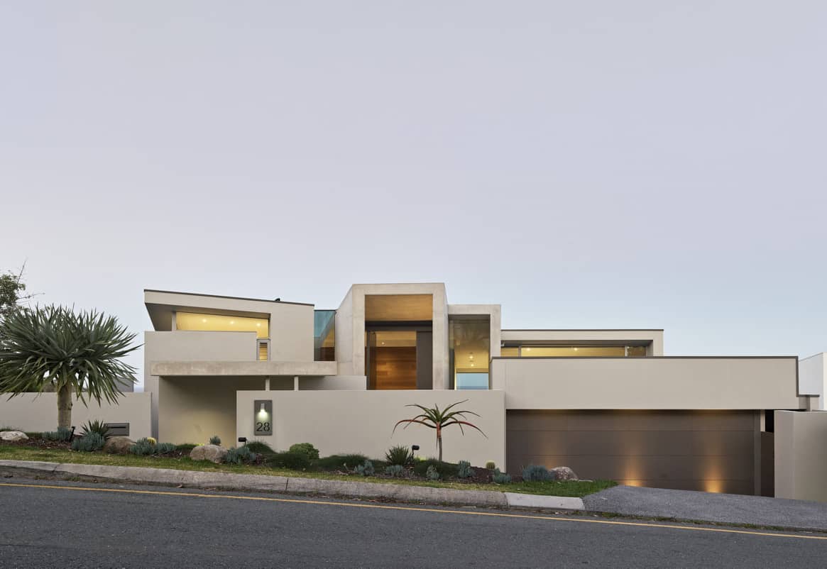 Exterior photography of modern façade/house; sunset mode frontal street view.