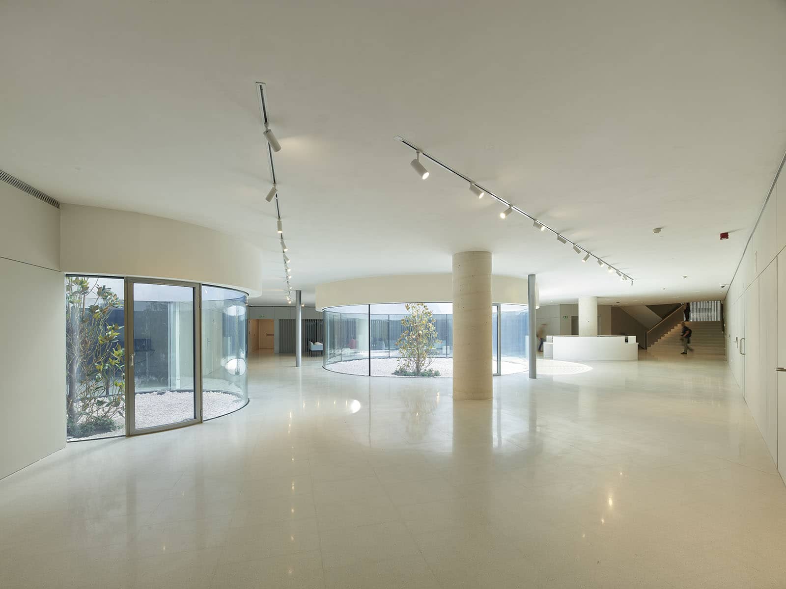 Interior photography of minimalist public white building.