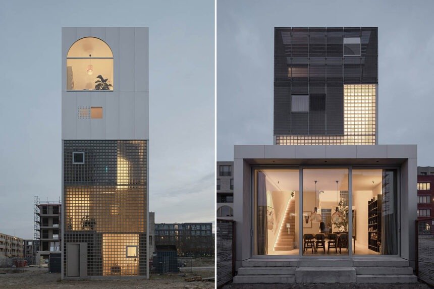 A split image displaying two views of a modern, multi-story tower-style home at dusk. On the left, the exterior shows a tall, narrow building featuring a lower half made of illuminated glass blocks and a smooth, white upper section with a arched top window. On the right, a wider perspective reveals a ground-floor living space illuminated through large sliding glass doors, showing a dining area and an interior staircase, with the upper screen-clad structure above it.